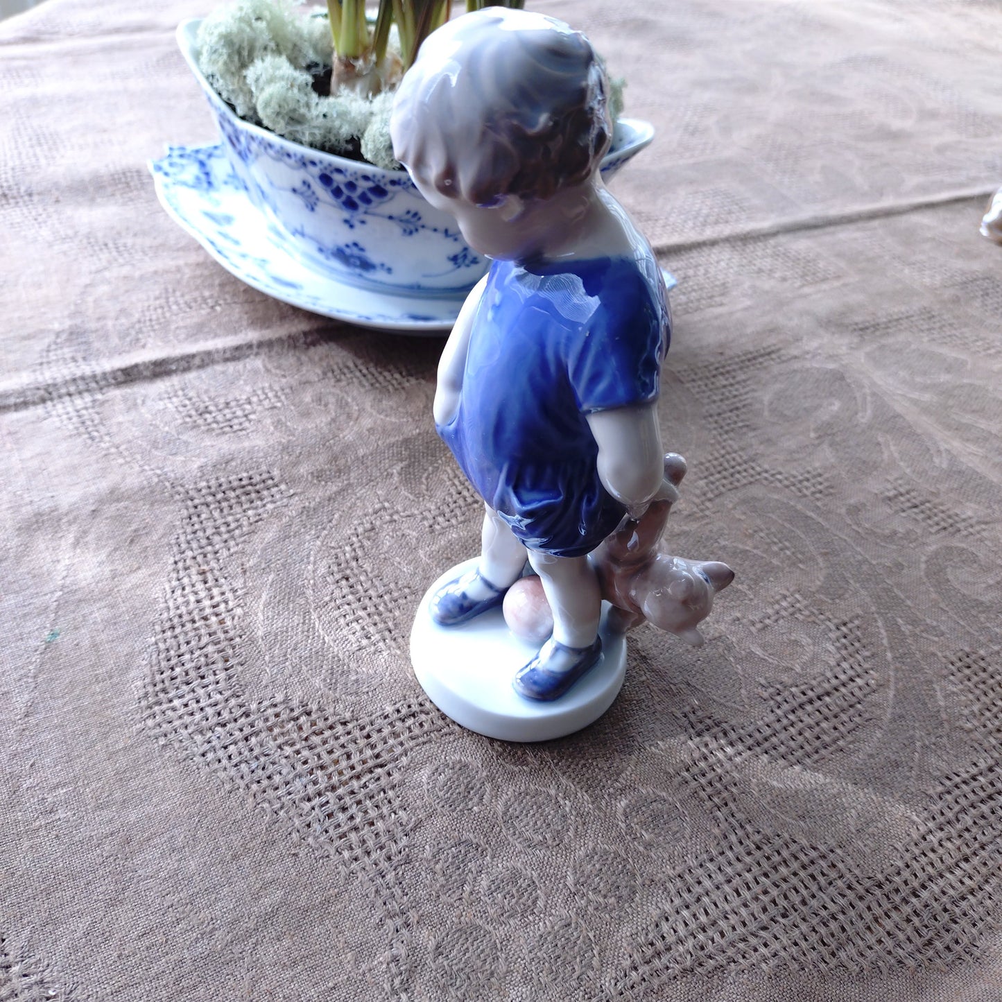 The boy with the Royal Copenhagen teddy bear is approximately 18.5 cm (H).