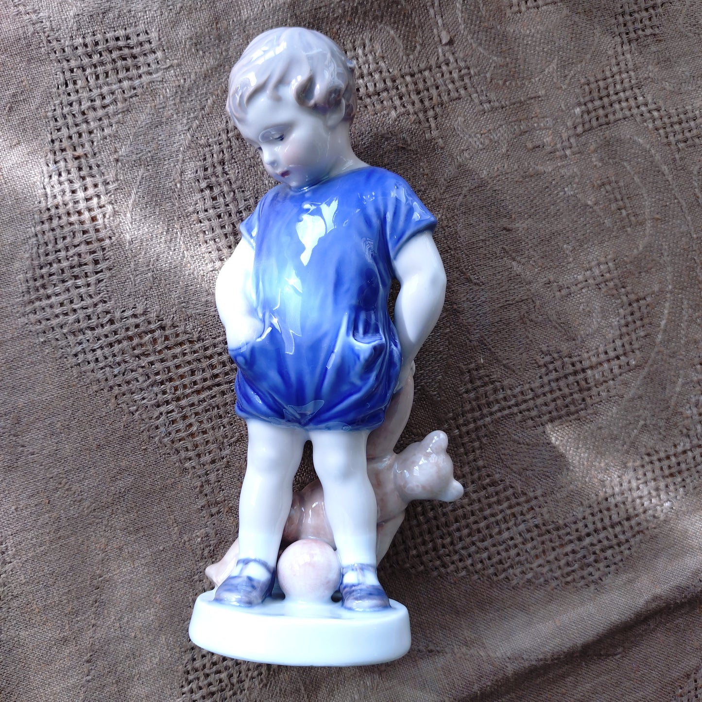 The boy with the Royal Copenhagen teddy bear is approximately 18.5 cm (H).
