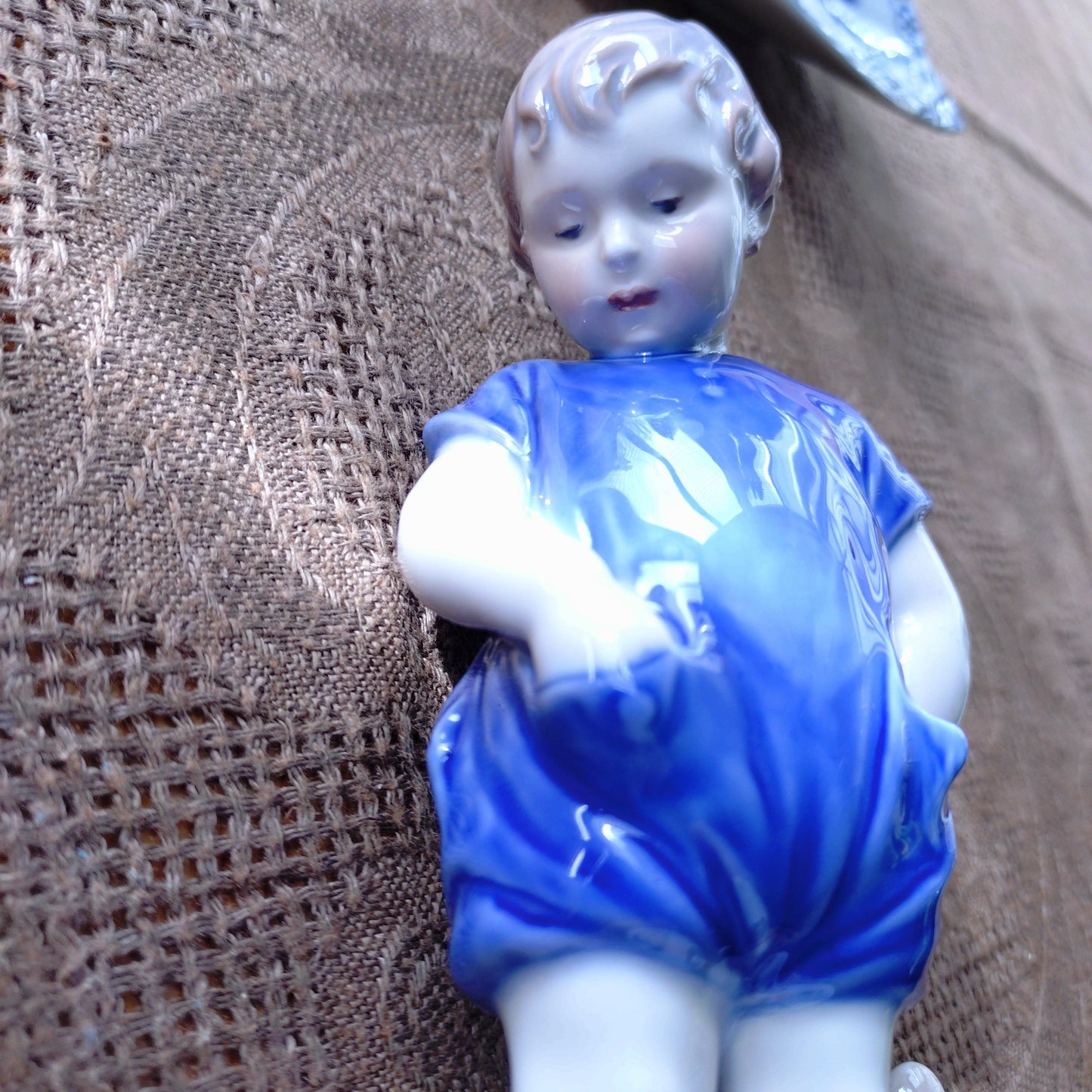 The boy with the Royal Copenhagen teddy bear is approximately 18.5 cm (H).