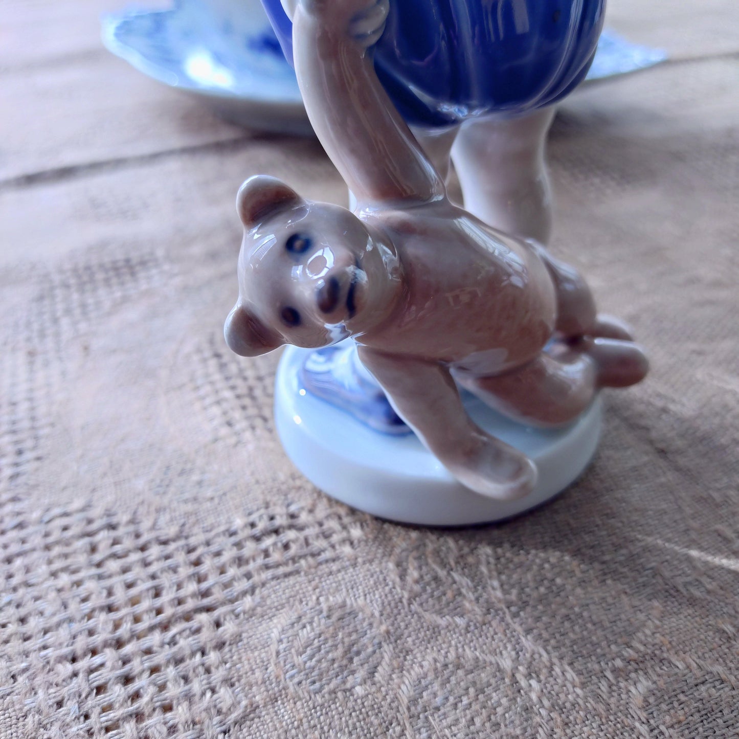The boy with the Royal Copenhagen teddy bear is approximately 18.5 cm (H).